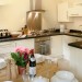 Shaker style fully equipped kitchen: dishwasher, fridge, freezer, wine cooler, gas hob - oven